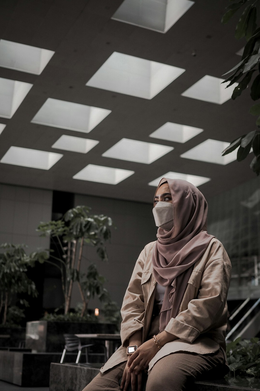Studio portrait of a Malay Singaporean woman wearing a hijab in business attire