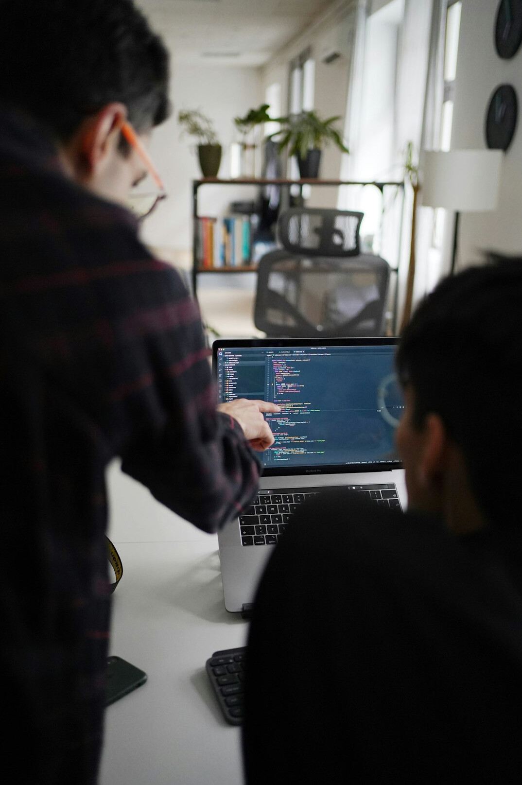 team discussing code in office