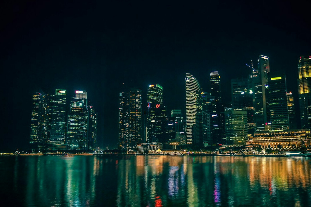 Singapore skyline with Marina Bay skyscrapers illuminated at night