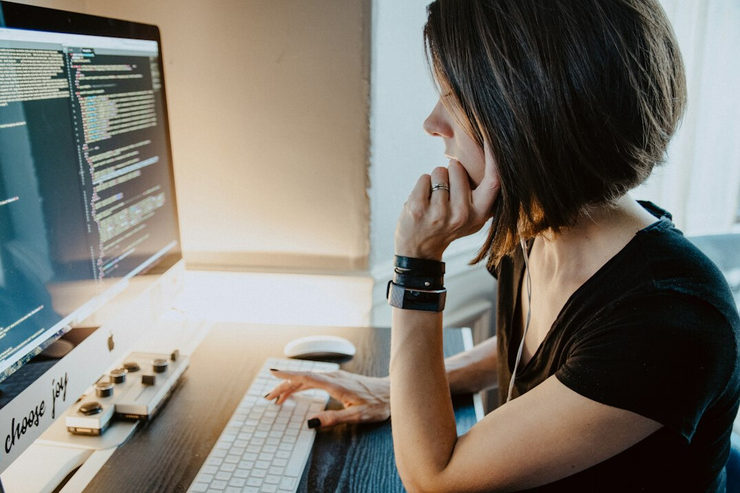 programmer coding at desk